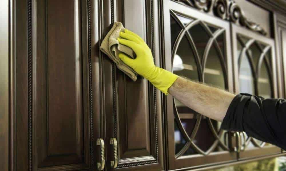 Applied A Furniture Polish To Wood Kitchen Cabinets 